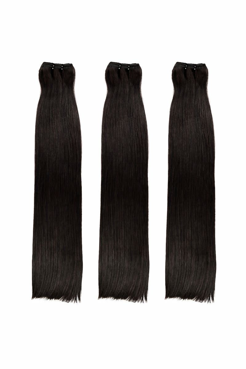 Three black hair extensions on a white background