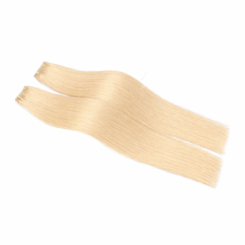 Two blonde hair extensions on a white background