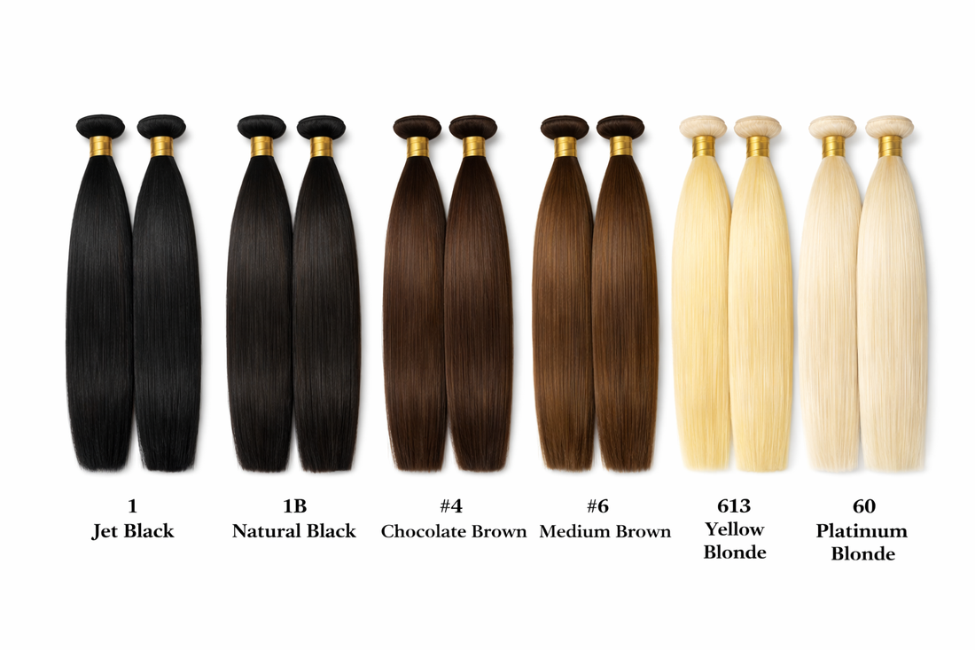 Three bundles of straight black hair extensions on a white background