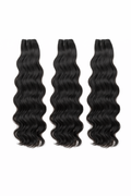 Three bundles of black wavy hair extensions on a white background
