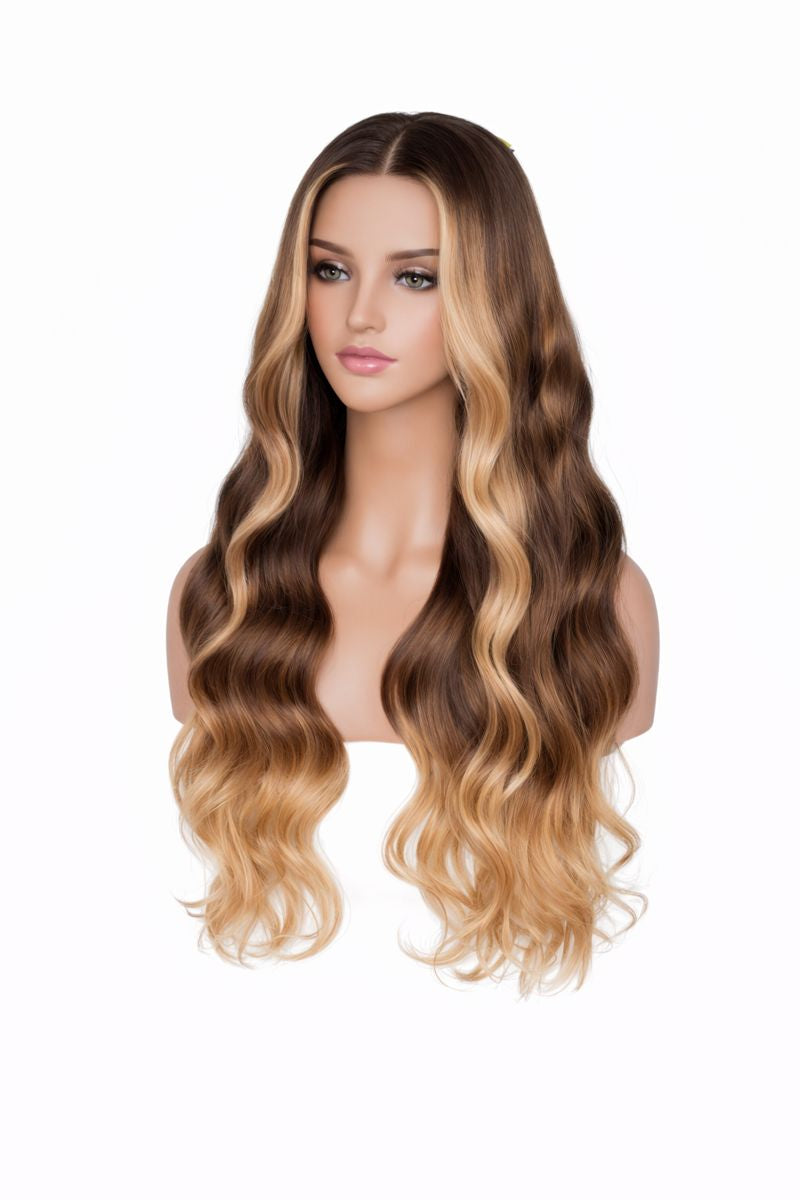 Mannequin head with long, wavy, brown and blonde wig on a white background