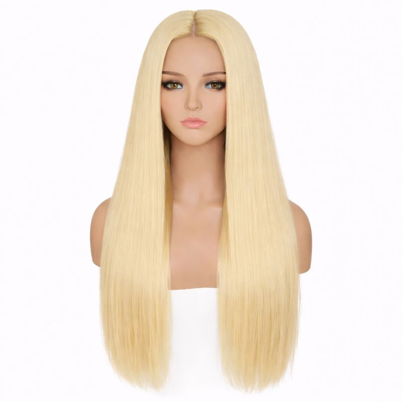 Blonde wig on a mannequin head against a white background