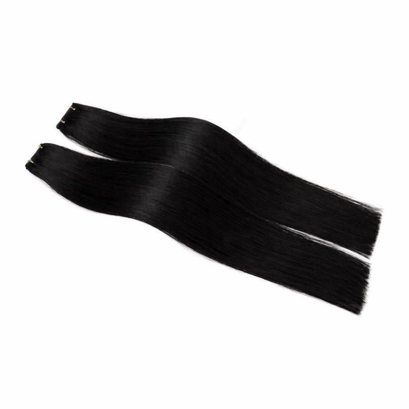 Two black hair extensions on a white background