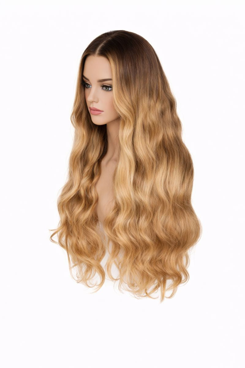 Blonde wig with wavy hair on a mannequin head against a white background