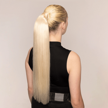 The extension is available in various lengths and colors, including the dirty blonde shade shown.